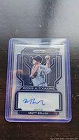 Matt Brash rookie autograph baseball card showing front of card with player's pitching action pose, autograph on bottom label, and protective sleeve.