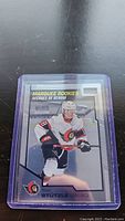 Hockey card of Tim Stutzle from Marquee Rookies series showing him in Ottawa Senators uniform.