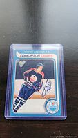 Front view of Wayne Gretzky hockey card enclosed in plastic case showing color image and facsimile autograph.