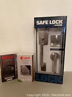 Full view of Weiser Safe Lock boxed set alongside August Smart Lock and August Doorbell Cam boxed units.