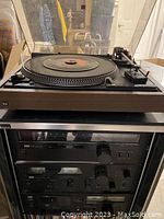 Full view of turntable on top of stereo stack, showing Dual 508 belt-drive turntable and underlying tuner