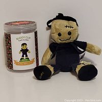 Full view of plush Frank N Stein Buddy Clip with scent container side by side