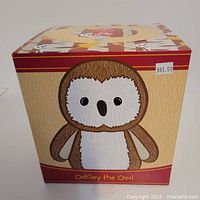 Front view of the box showing Oakley the Owl illustration with price tag $45.00.