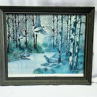 Overall view of framed print depicting band tail pigeons in a woodland setting with water and trees.