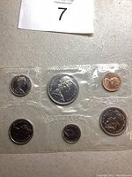 Front side of 1969 Canadian coin set in sealed plastic showing Queen Elizabeth II on coins.