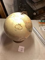 Full globe showing North and South America with French country names and decorative cartouche