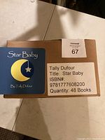 Box with label showing quantity of 48 books, title 'Star Baby' by Tally Dufour and ISBN number