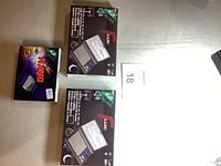 Three boxed new mini digital scales shown. Two boxes of Lux model and one box of Nano model by KE Scales.