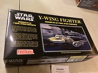Box top showing Star Wars Y-Wing Fighter model branding and artwork.