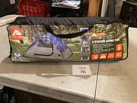 Photo of the tent in its storage carry bag showing the Coleman WeatherMaster branding and product image.