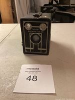 Front view of the Kodak Target Brownie Six-20 camera showing lens, dual windows, and branding.