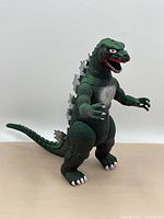Front view of vintage 13-inch Godzilla toy showing detailing and pose.