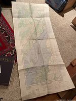 Map fully unfolded lying on carpet, showing geographical details from Mallorytown and surrounding areas from 1976.