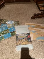 Navigation charts and the Smiths Falls to Merrickville map arranged on carpet with visible Canadian Hydrographic Service branding.