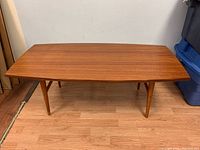 Front elevation showing full view of tabletop and tapered legs