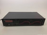 Front full view of Yamaha EQ-550 graphic equalizer showing all controls and display.