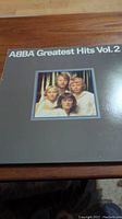 Front cover of ABBA Greatest Hits Vol. 2 album showing band members' photo and album title.