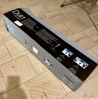 Full view of the original Accolade Duet ELPSC80 projection screen box showing branding and screen features.