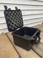 Open Pelican 1300 case showing foam padded lid and empty interior providing protection for contents.