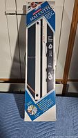 Photo of the mat cutter in original packaging showing front of the box with branding and features