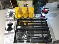 Full lot with all items displayed: mini lantern radio, 3 yellow flashlights, iGrill thermometer, BBQ utensils, and red mini lantern.