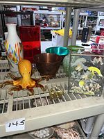 Photo of entire assortment on metal shelf, showing all six items grouped together.
