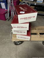 Four stacked Stillhouse River Tube boxes in red and white, labelled and unopened but inspected