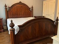 Straight-on front view of bed frame showing headboard and footboard