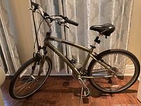 Full side view of the Trek Navigator 3.0 hybrid bike showing frame, wheels, handlebars and saddle