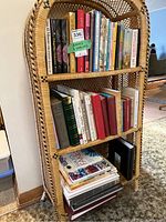 Overview of wicker three-shelf unit holding books and albums