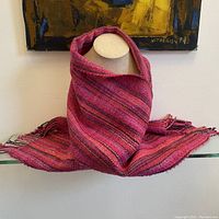 Scarf displayed draped on a mannequin torso showing overall shape, color, and length.