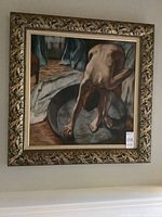 Framed painting on board depicting a woman bathing, viewed from the front.