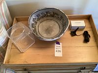 Wooden table with pottery bowl, plexiglass cover, and boxed microphone