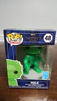 Front view of Hulk Funko Pop Art Series 48 in box showing green figure and packaging details