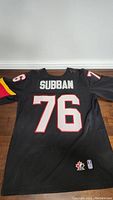 Back view of black hockey jersey showing name 'Subban' and number '76' with Team Canada logos near bottom hem.