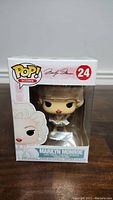 Front view of Marilyn Monroe Funko Pop in original packaging showing number 24 in series