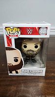 Front view of the WWE Braun Strowman Funko Pop in original packaging showing figure and branding.