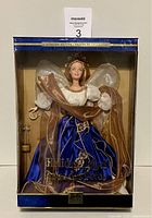 Front view of the unopened 2000 Holiday Angel Barbie in original collector box showing the doll fully visible with angel wings and detailed outfit.