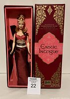 Front view of the Barbie doll inside its original box with decorative exterior and stand.