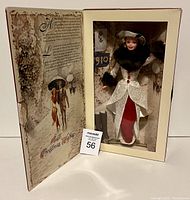 Holiday Barbie doll inside original box showing full outfit, box artwork, and included accessories.