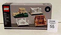 Front photo of sealed Lego box showing set featuring Lego miniature replicas of the Great Wall of China, Parthenon, Taj Mahal, and Colosseum. Set number 40585, 382 pieces, age 12+. Sealed packaging with MaxSold lot number card.