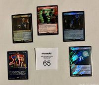 Five Magic The Gathering cards from the Magic x Doctor Who collaboration displayed with a MaxSold auction number card. Cards feature The Third Doctor, Dan Lewis, Martha Jones, The Sixth Doctor, and one holographic card.