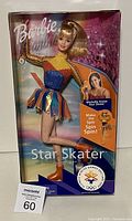 Star Skater Barbie doll in original packaging with Olympic Salt Lake 2002 logo and Michelle Kwan image, showing front of box and doll detail.