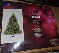 Box of 7.5 foot Madison Pine artificial Christmas tree by WholeHome Noel showing features like 650 clear lights, 2150 branch tips, 61 inch diameter.