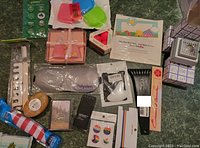 Overview of assorted new personal care and household items on a surface.