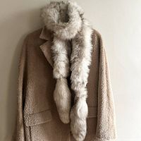 Fox fur neck warmer scarf styled on coat showing length and scale.