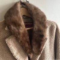 Close-up photo of the vintage mink fur collar on a coat for scale showing the fur texture and collar shape.