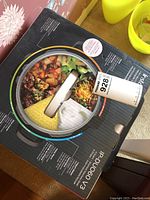 Photo of Instant Pot Duo 7-in-1 box showing product features and cooked food images printed on top.