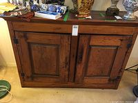 Front view of full hutch showing two panel doors and overall finish