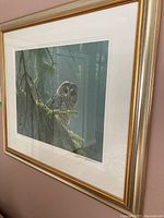 Full front view of framed print hanging on wall